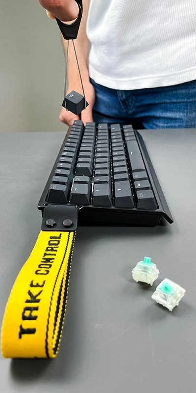 Wooting 60HE+ showing the pulling of a keycap with the keycap puller