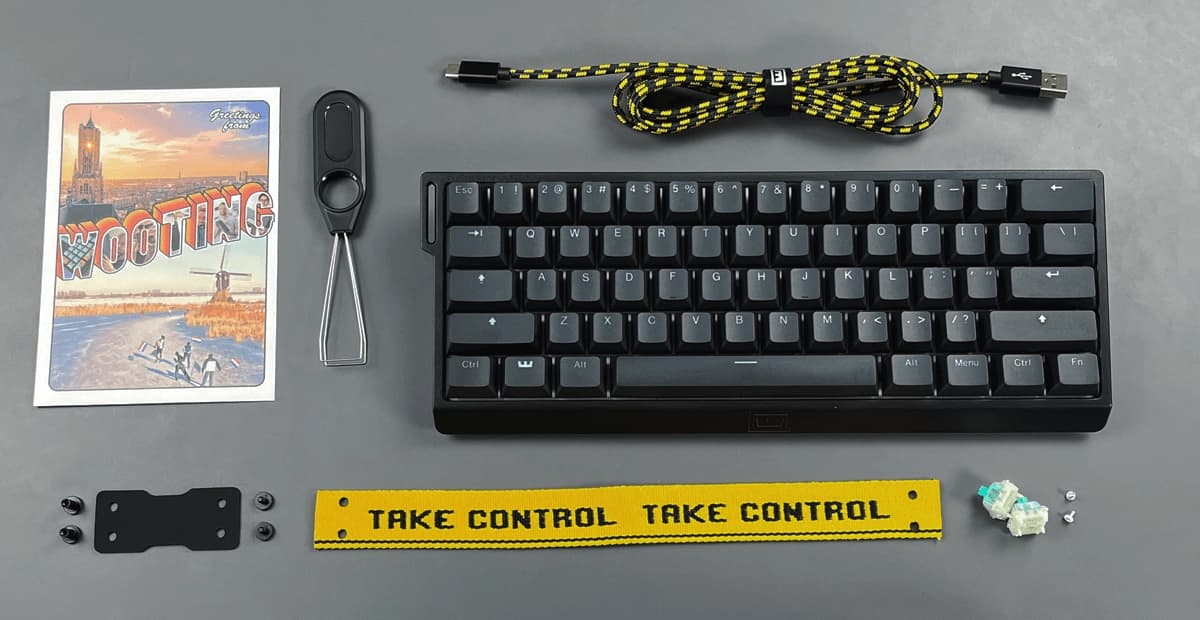 Wooting 60HE+ with ANSI layout showing all items in the box