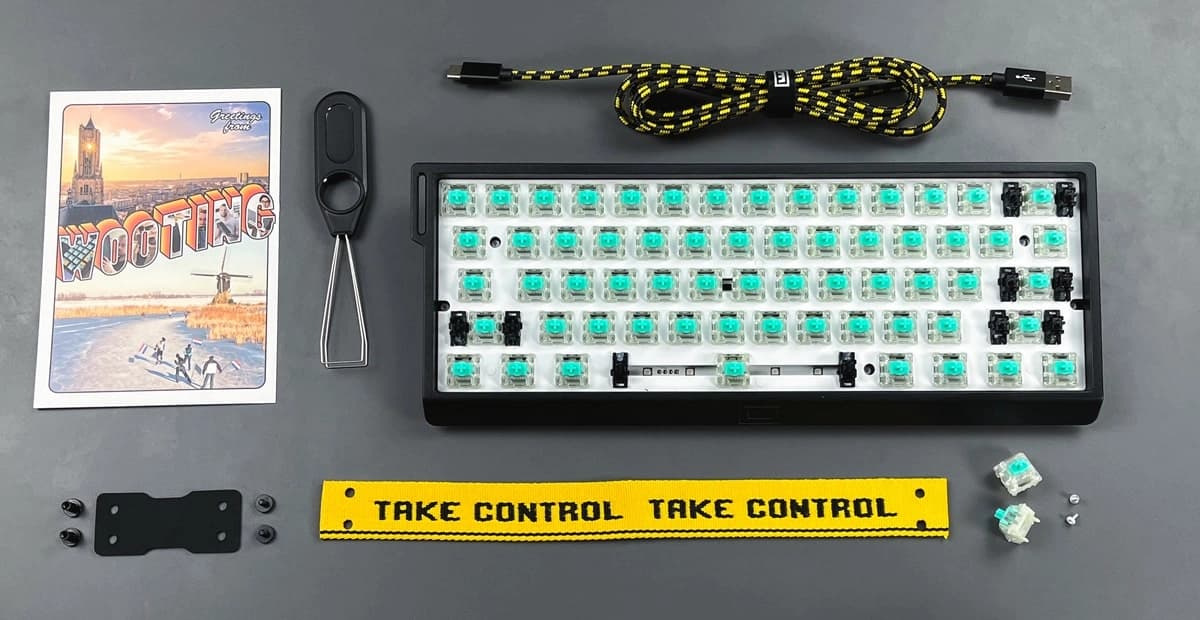 Wooting 60HE+ with ISO layout showing all items in the box