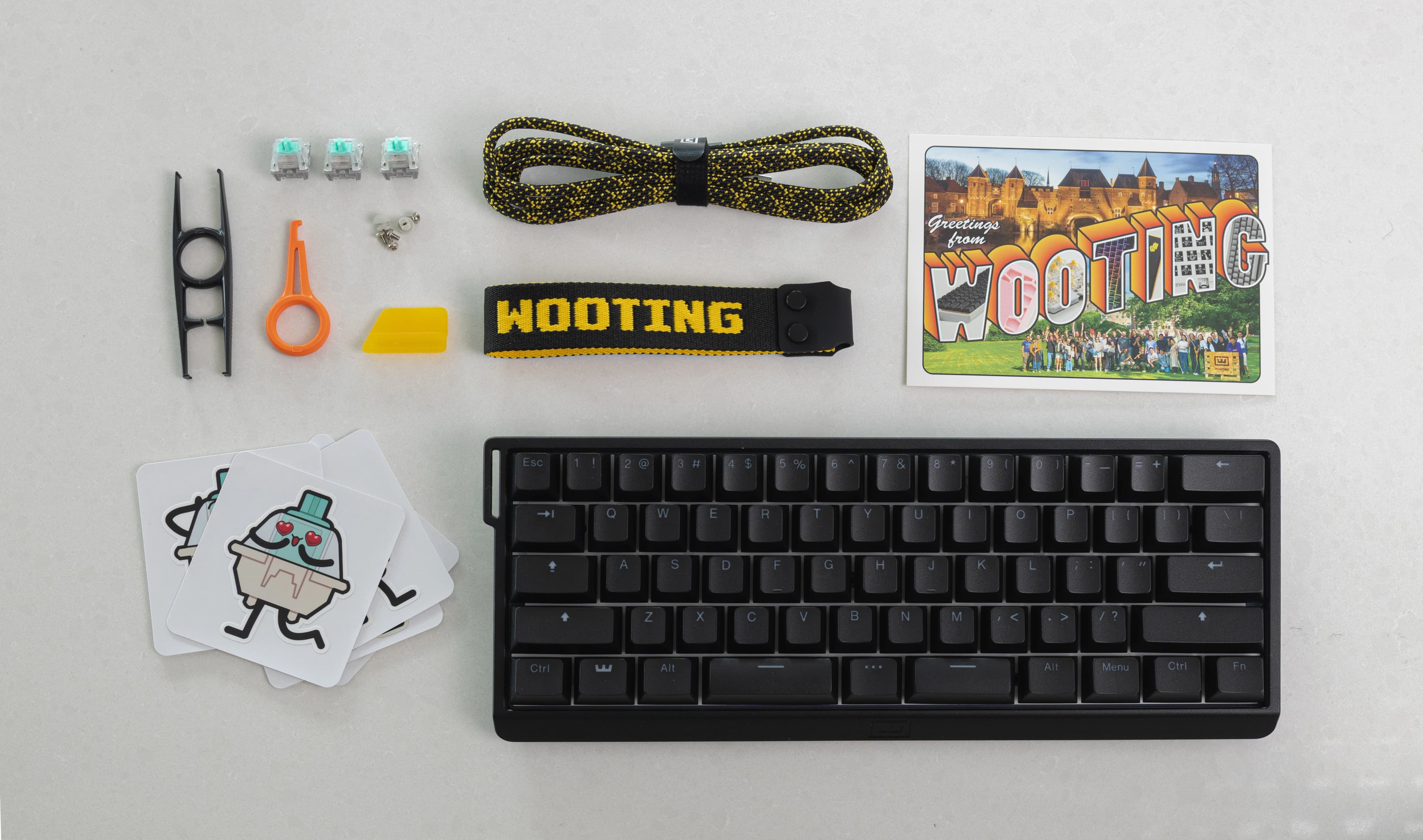 Wooting 60HE v2 with ANSI layout showing all items in the box