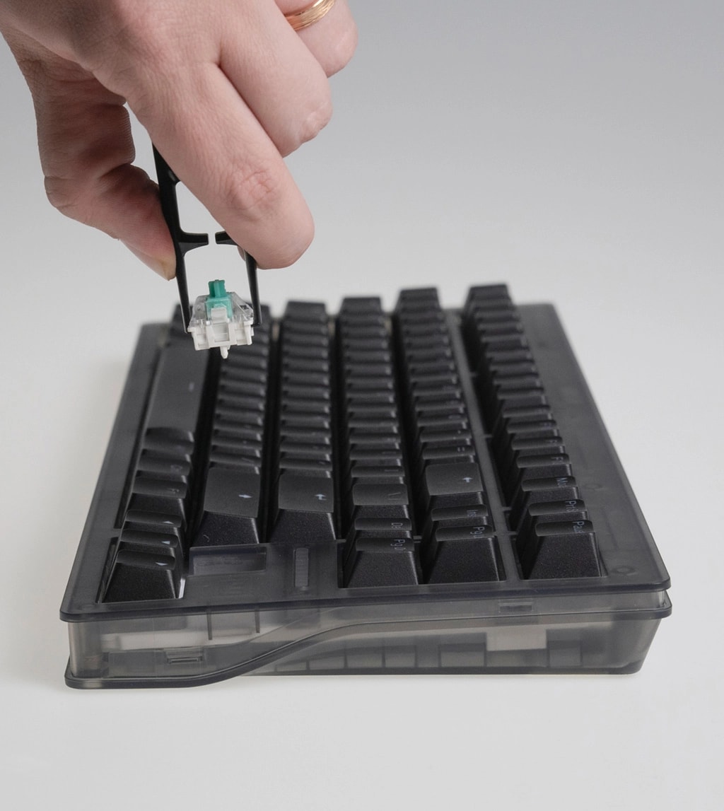 Wooting 80HE showing the switch being lifted out of the socket