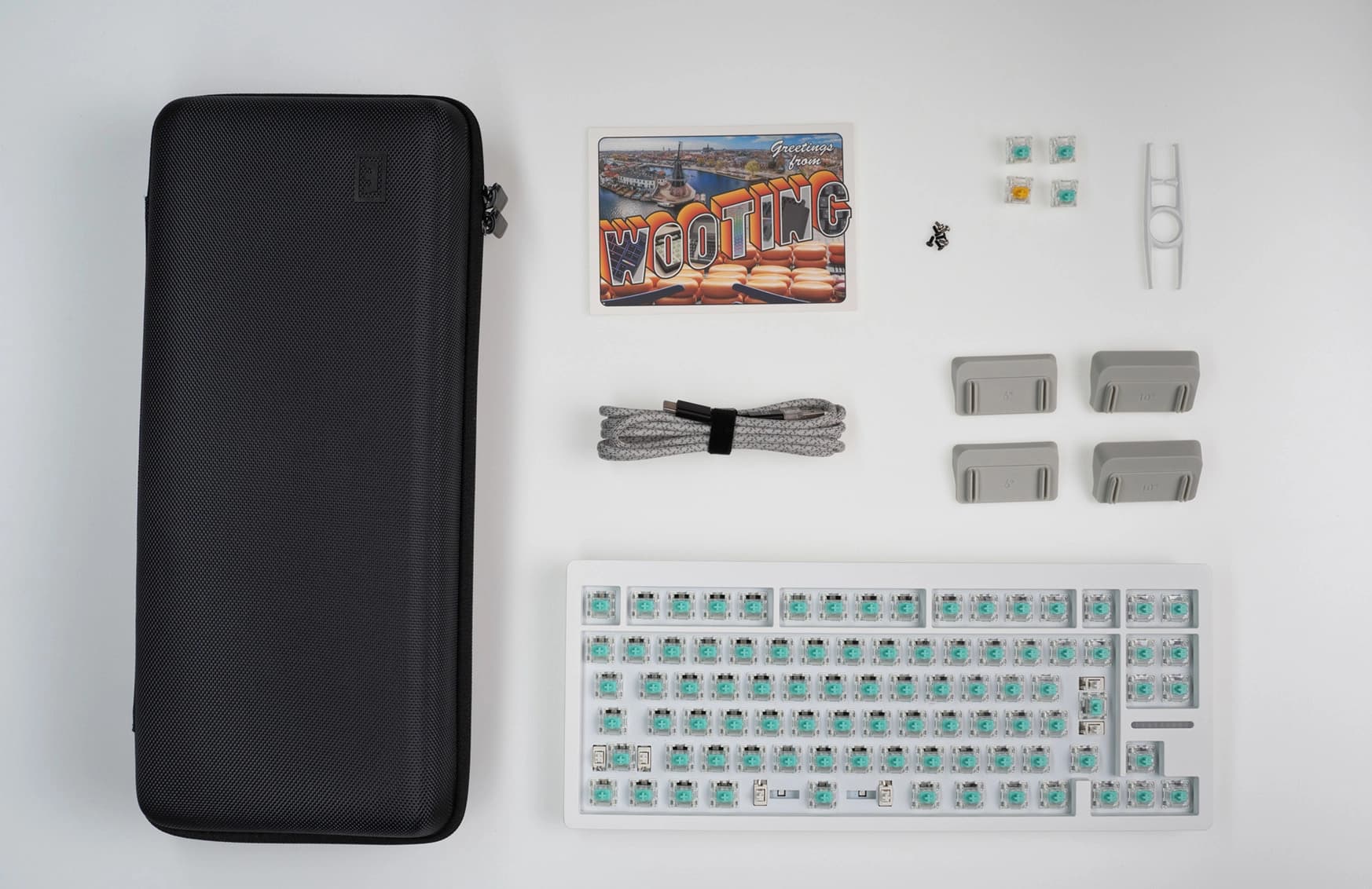 Zinc Alloy Wooting 80HE with ISO JIS layout showing all items in the box