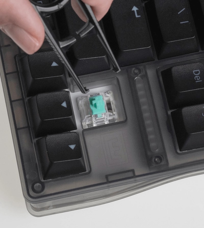 Wooting 80HE TenZ Takeover Edition showing the alignment of the switch puller over a switch